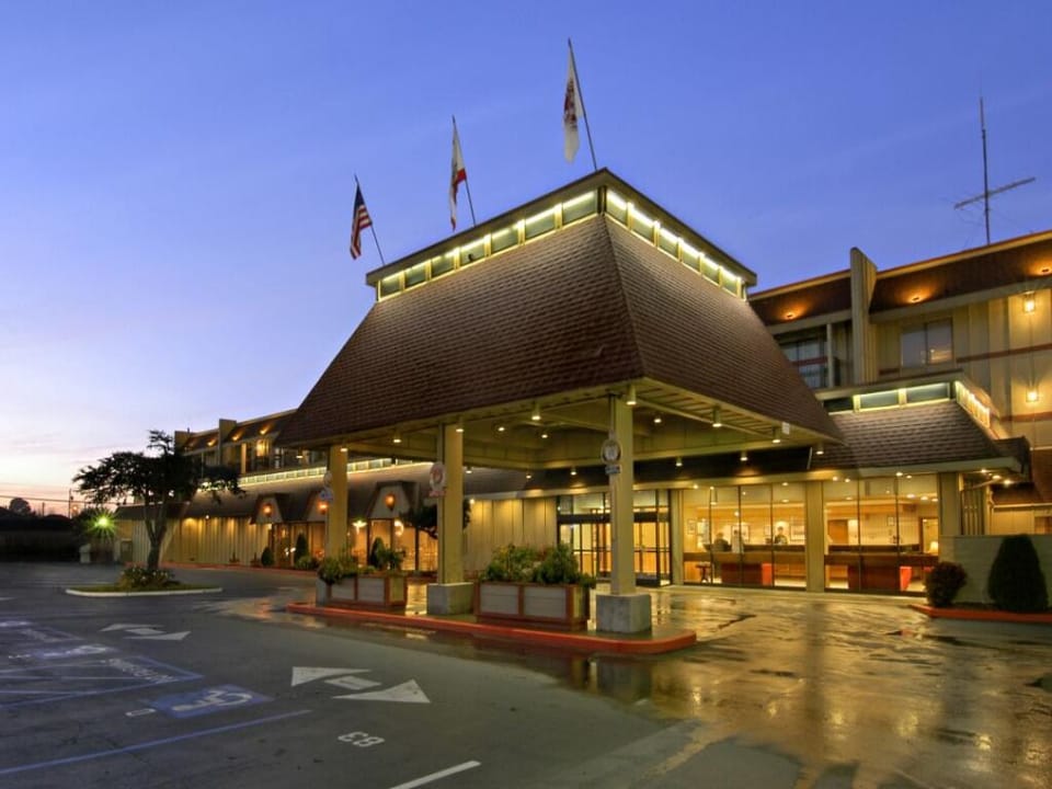 Pull up at dusk to a welcoming, well-lit entrance.