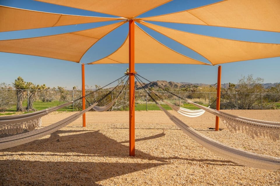 Swing into relaxation beneath the shade with peaceful desert views.