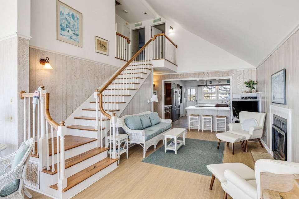 Living area with comfortable sofas and chairs and a flat-screen TV
