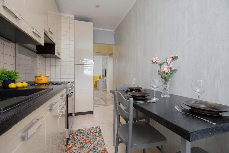 Compact kitchen view highlighting countertop workspace and built-in appliances.