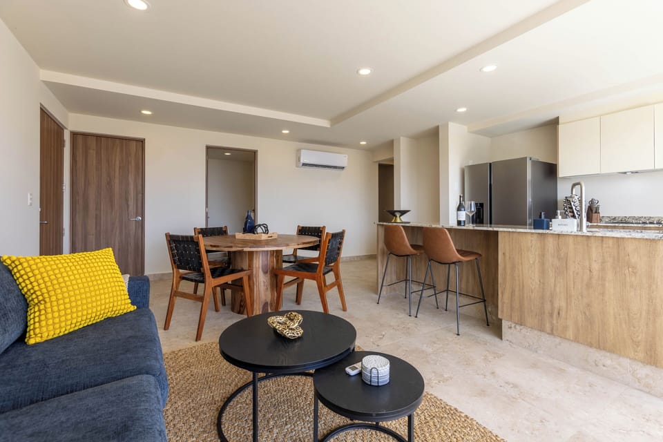 Open concept with dining table and bar seating