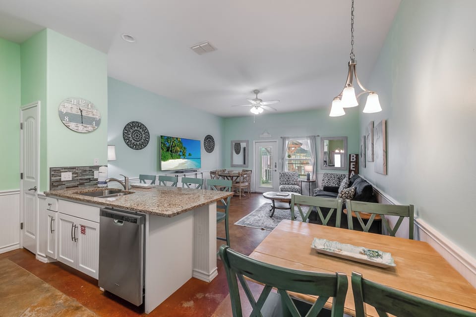 Step into your bright, open-concept retreat where coastal colors and granite counters create the perfect space for your memorable meals together.