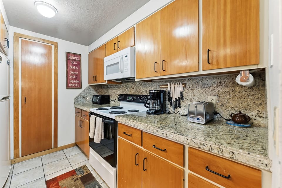 Your fully equipped kitchen features granite counters, modern appliances, and everything needed to create memorable meals during your stay.