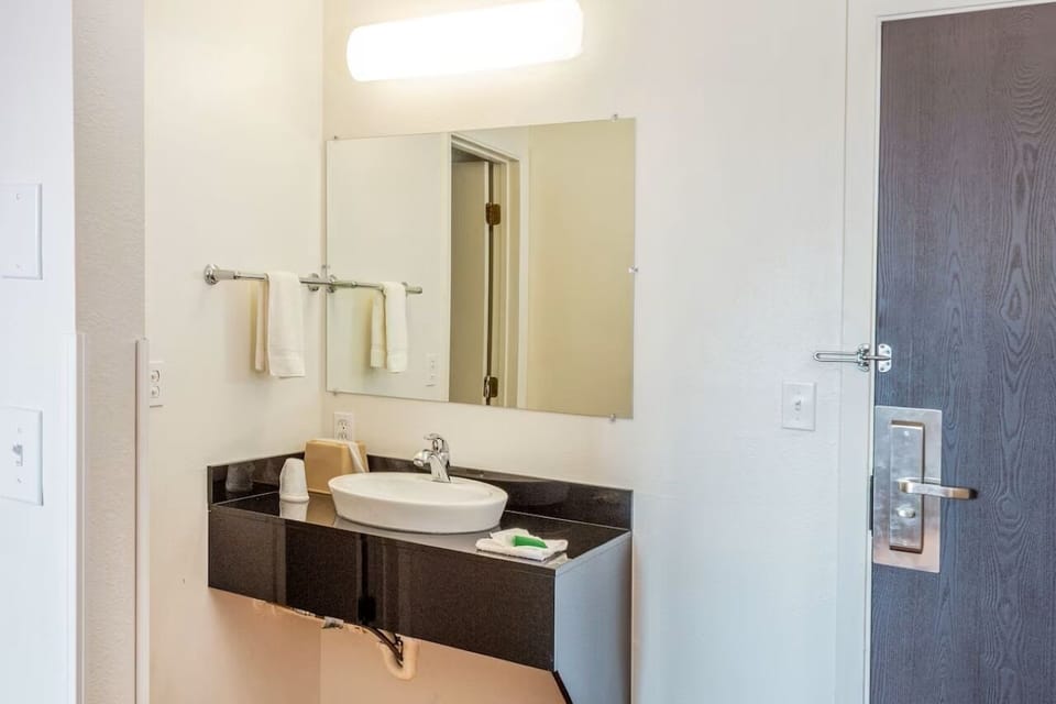Get ready comfortably with bright mirror lighting and spacious vanity.