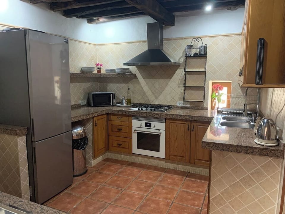 Fully equipped kitchen which is the original part of the house.