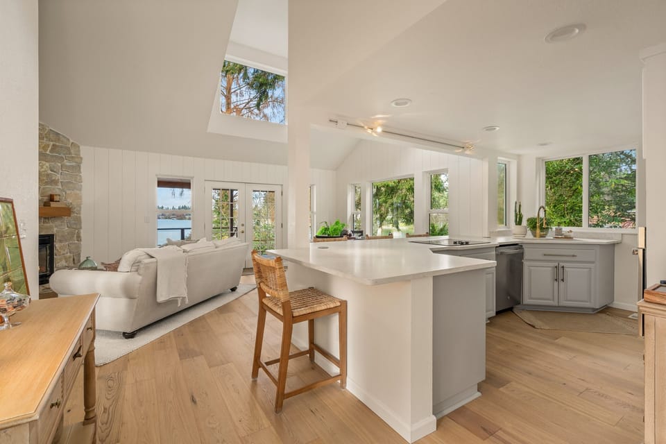Great room lives so much more open and the views of the lake fill the room.