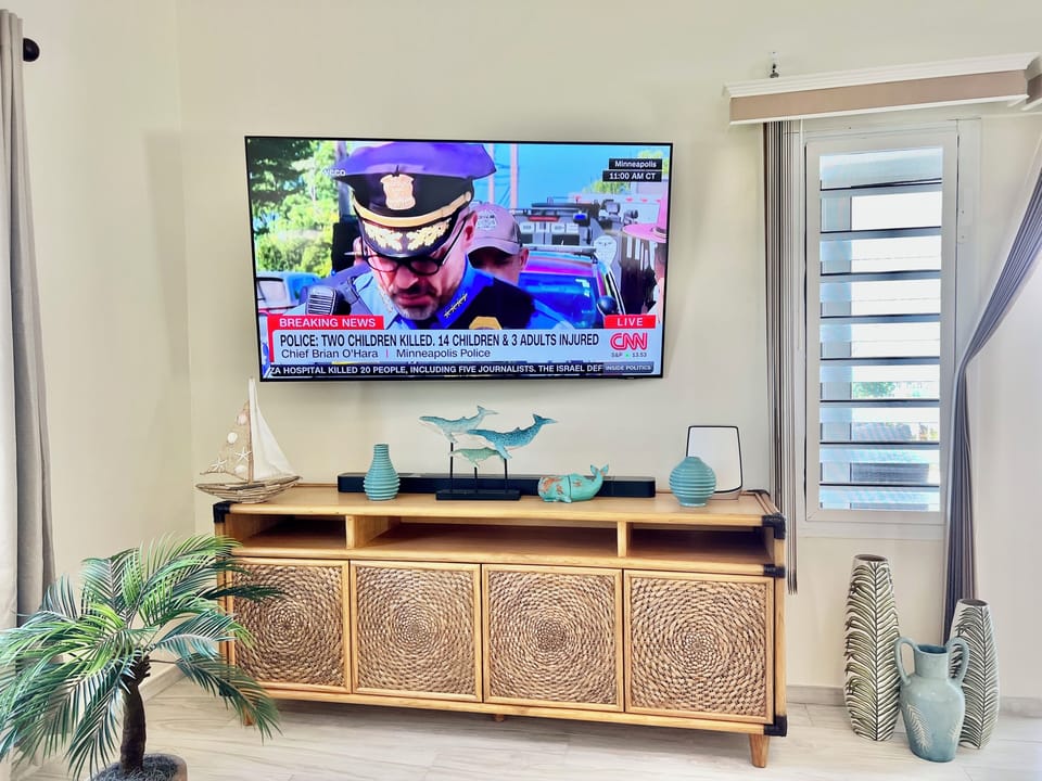 Living room with 65” Samsung smart tv with JBL soundbar.