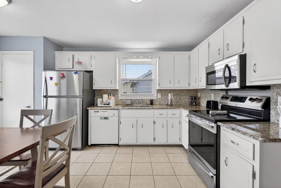 Fully equipped kitchen with coffee bar and laundry included.