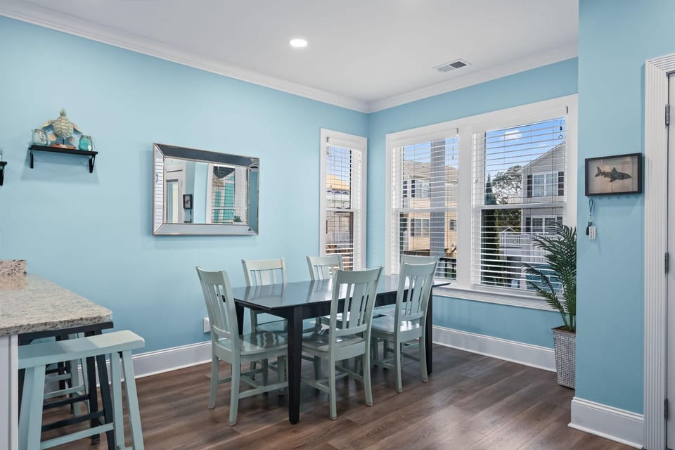 Bright dining nook with waterfront views and cozy seating