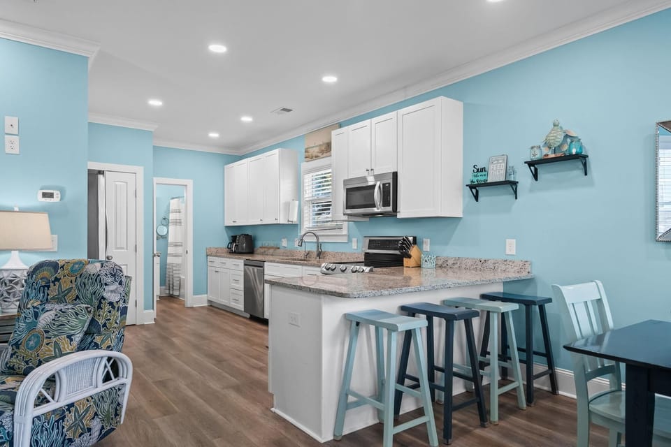 Bright, airy kitchen with cozy breakfast bar seating