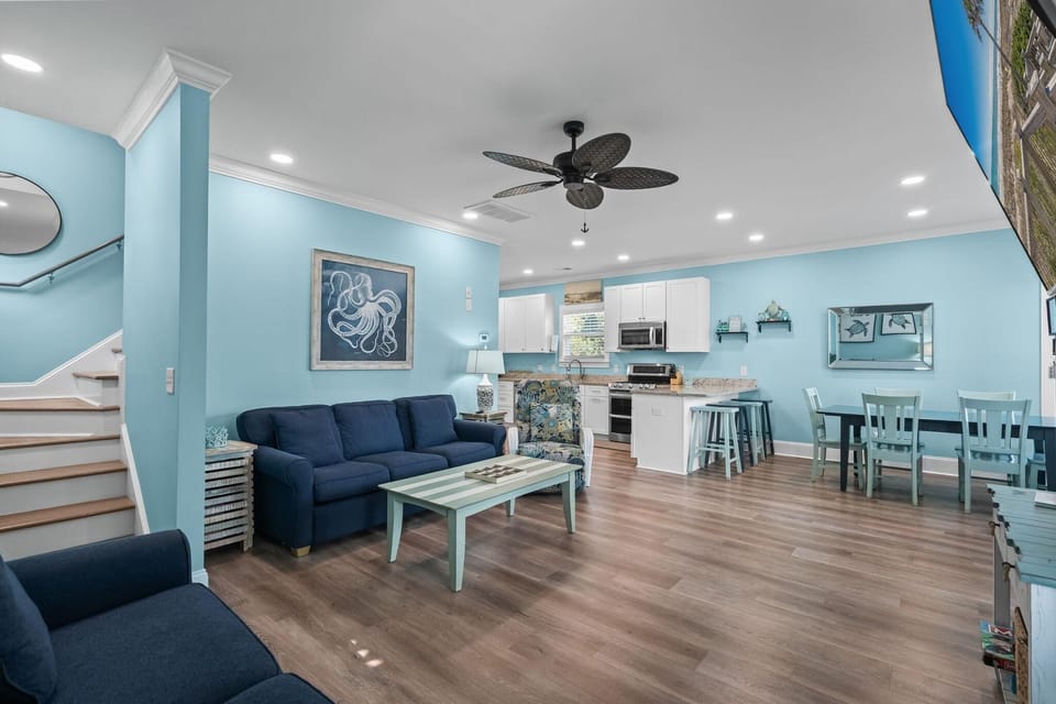 Spacious open-concept living and dining area with coastal charm