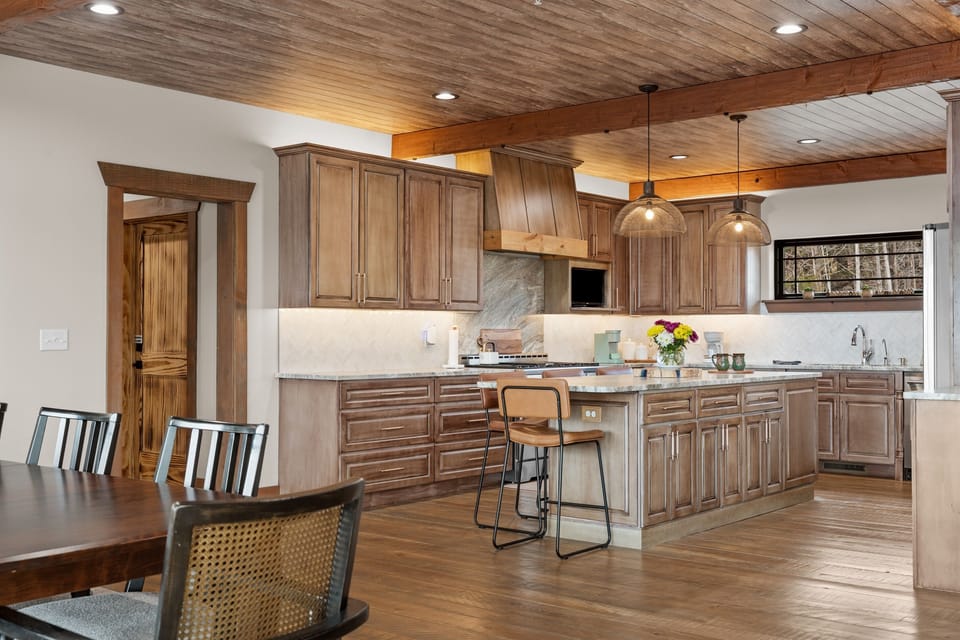 Warm wood tones and soft lighting make this kitchen feel instantly inviting—perfect for slow breakfasts, home-cooked meals, and time spent together.