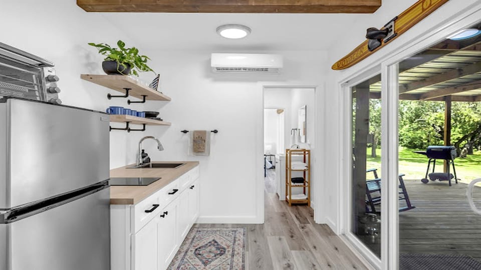 Light-filled kitchen with seamless access to the covered deck.
