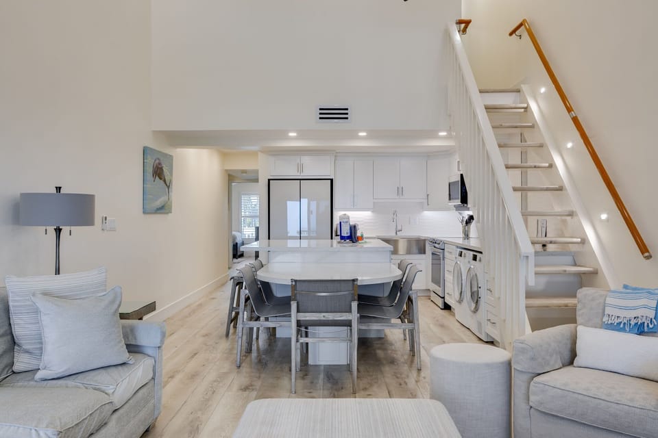 Gorgeous living room and kitchen with expansive island, new Samsung Bespoke appliances