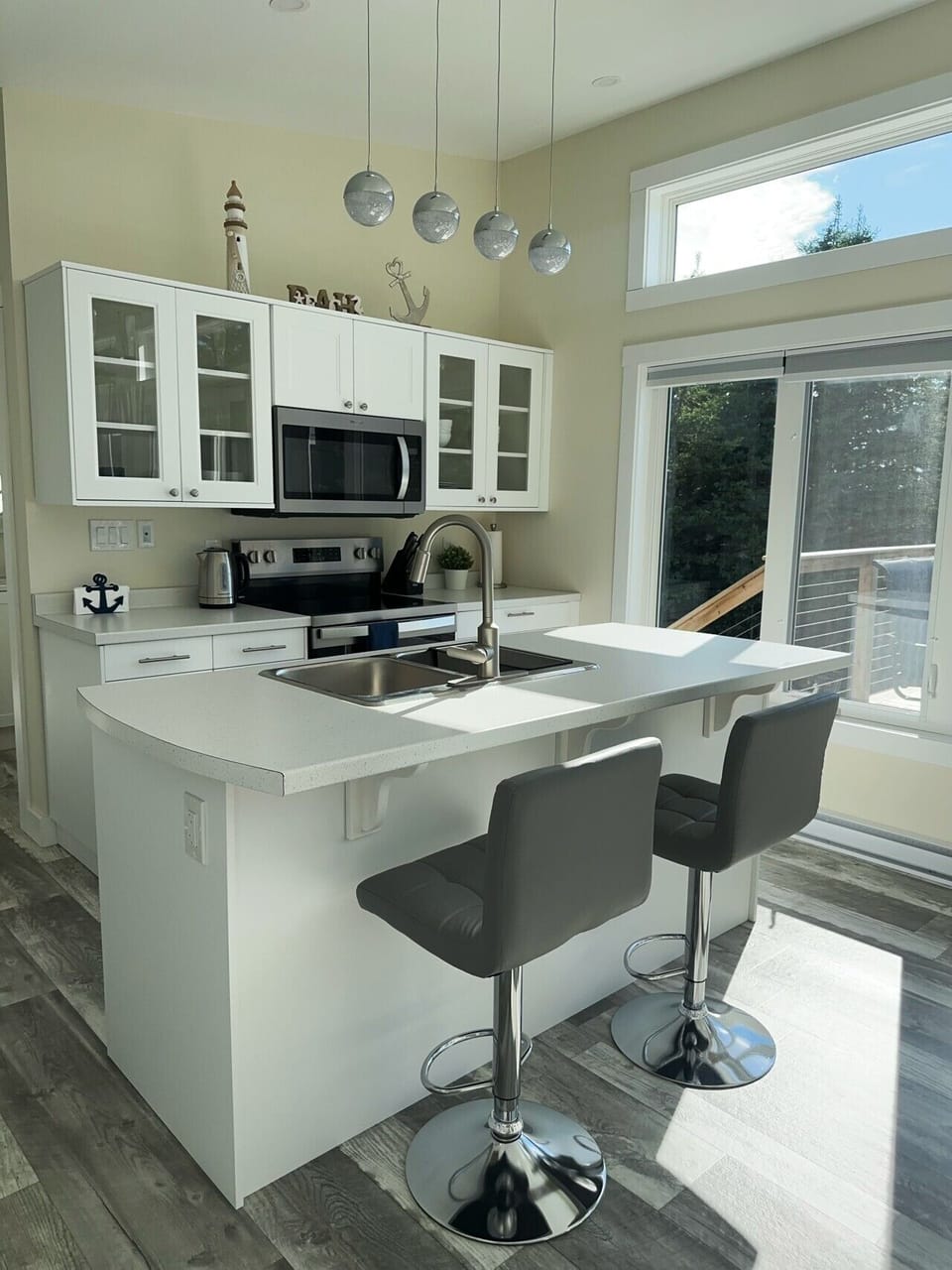 Entertainment kitchen with island and bar stools