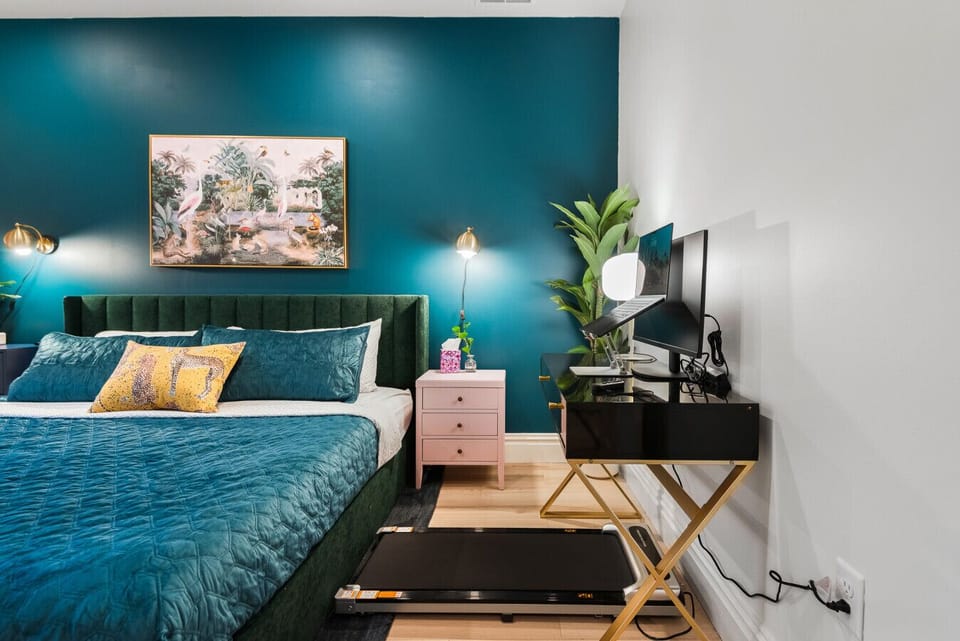 The `Work-from-Home` Haven: Stay productive in our dedicated workspace, featuring a sleek desk and a convenient under-desk treadmill.