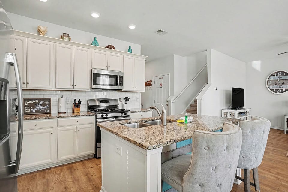 Open kitchen layout with clear sightlines to the living area, perfect for entertaining.