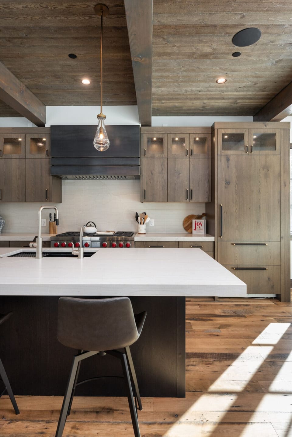 Chef’s kitchen with large island, Wolf and Sub-Zero premium appliances, and custom cabinetry