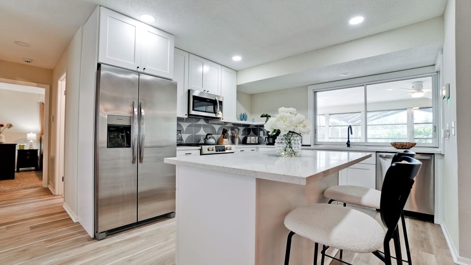 Fully equipped kitchen with island and complementary coffee bar