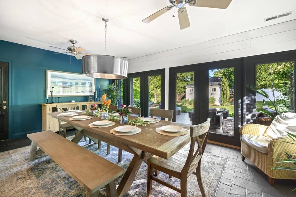 Entertain your guests and visitors in the expansive dining room (seats up to 12) with doors that open out to the fresh air of the backyard.