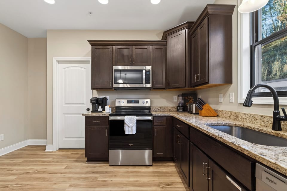 A spacious, fully equipped kitchen with island seating—perfect for group meals and morning coffee.