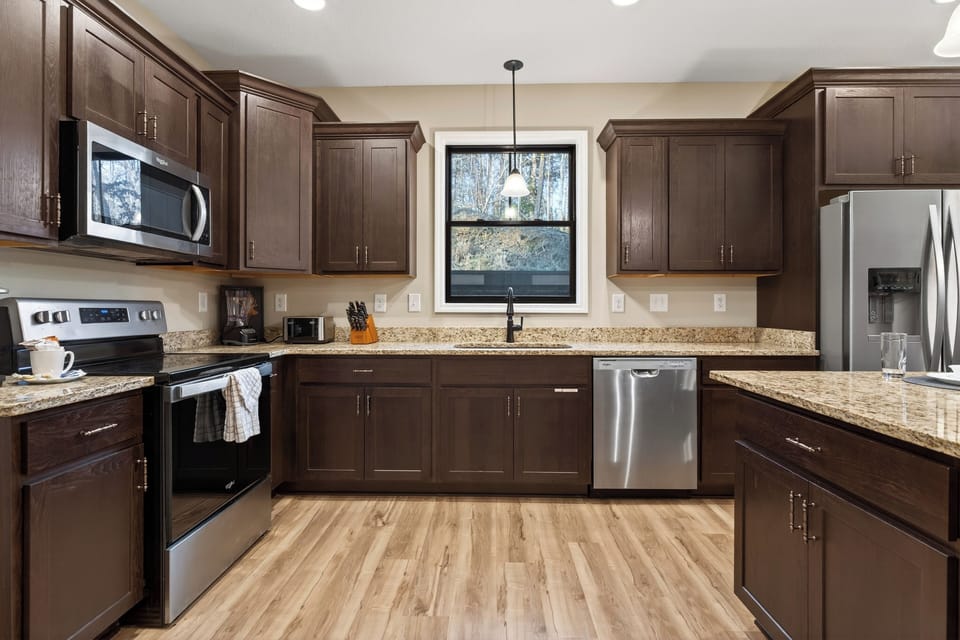A spacious, fully equipped kitchen with island seating—perfect for group meals and morning coffee.