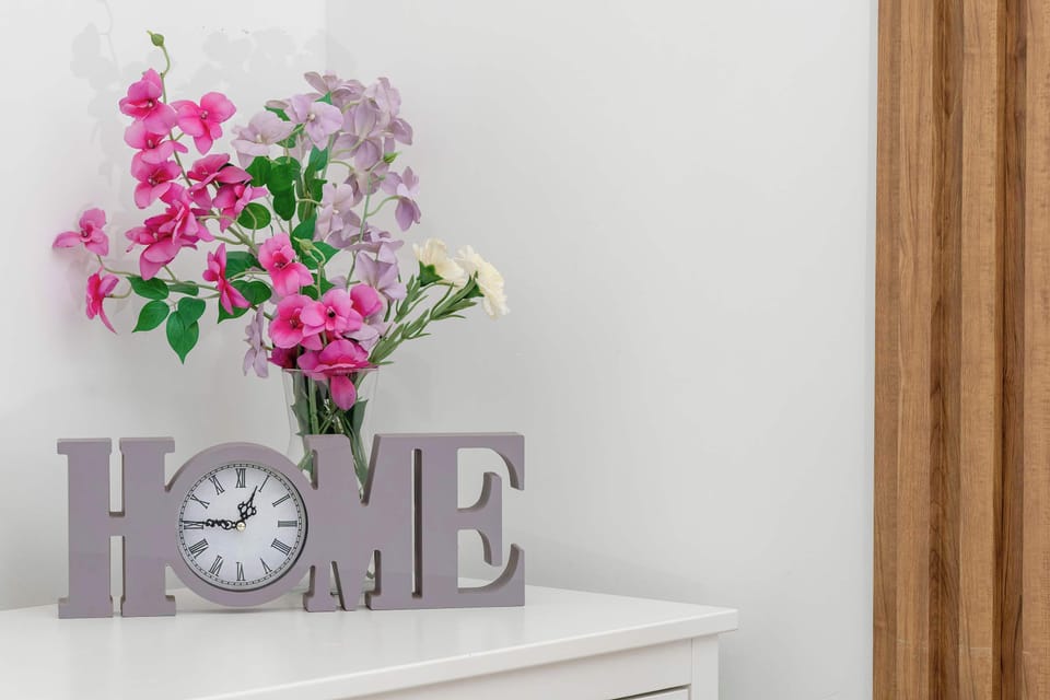 Decorative interior detail with flowers, accent shelf, and homely styling.
