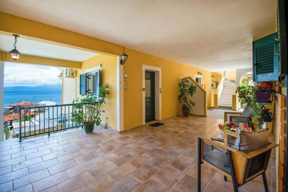 Spacious Covered Terrace with Lounge Seating and Sea View