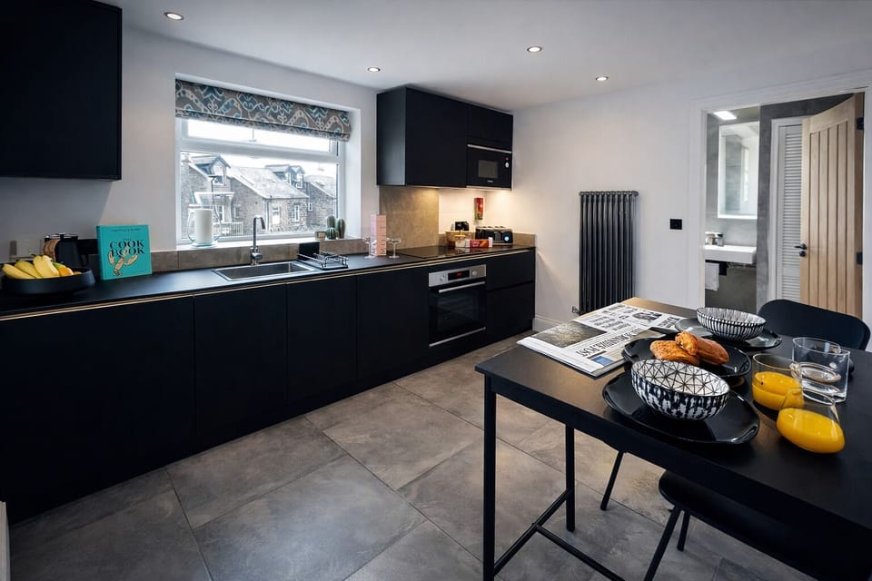 A kitchen equipped with every thing you should need for a spot of cooking 