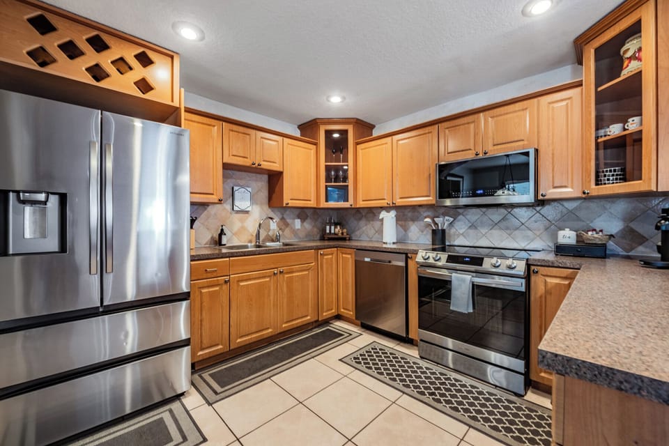 Whip up meals in style! Our kitchen boasts sleek stainless steel appliances, ample cabinets, and plenty of countertop space for all your cooking adventures.