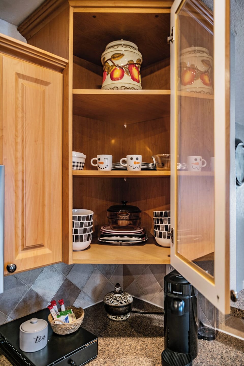 Our kitchen cupboards are fully stocked with plates, cups, and even wine glasses, everything you need to whip up meals and enjoy them with family and friends.