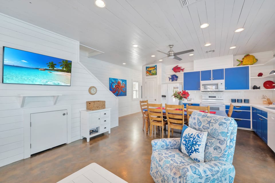 Your bright coastal haven features a fully equipped kitchen, cozy dining space, and charming ocean-themed decor that brings seaside tranquility indoors.