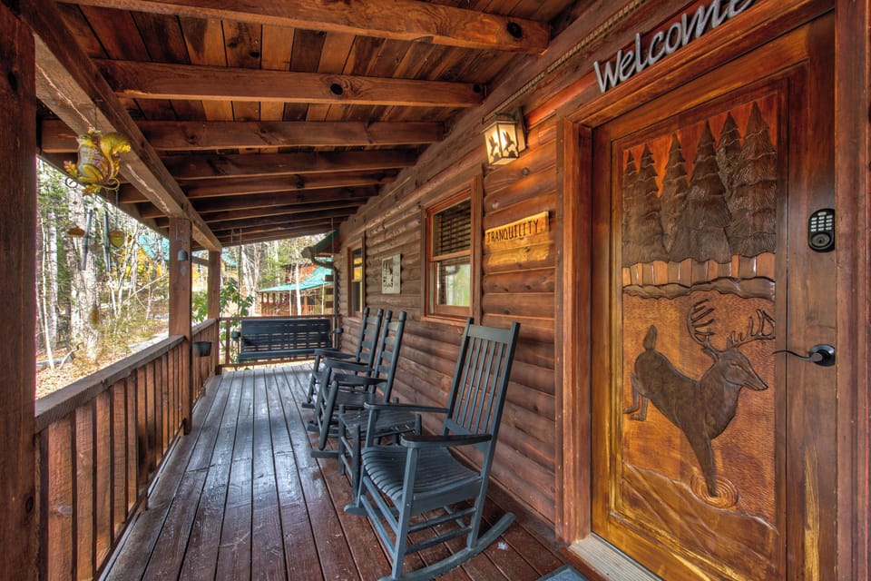 Your private covered porch features handcrafted rocking chairs where you can unwind while taking in peaceful forest views.