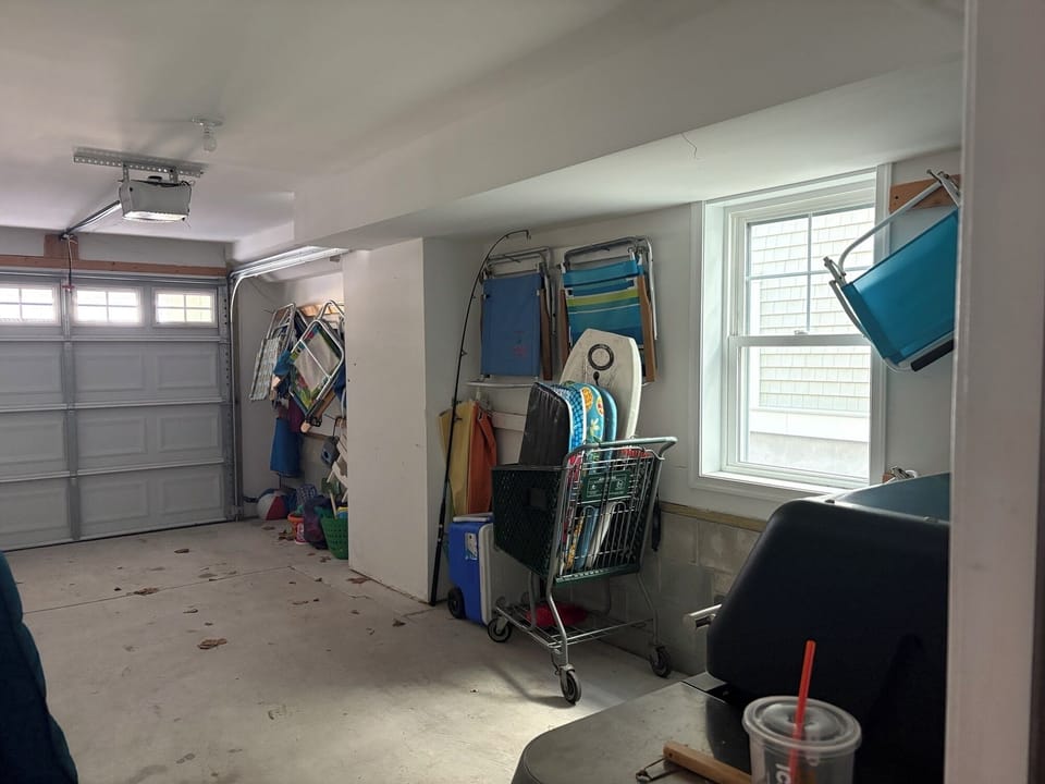Garage with beach supplies & portable grill.