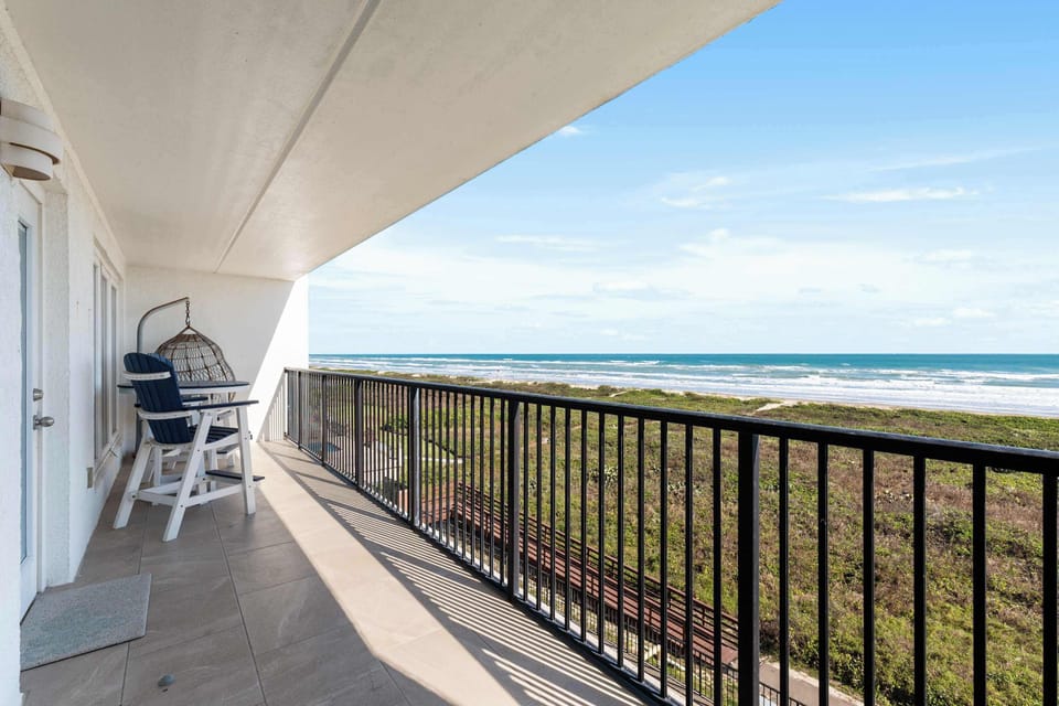 Private beachfront balcony with sweeping ocean views