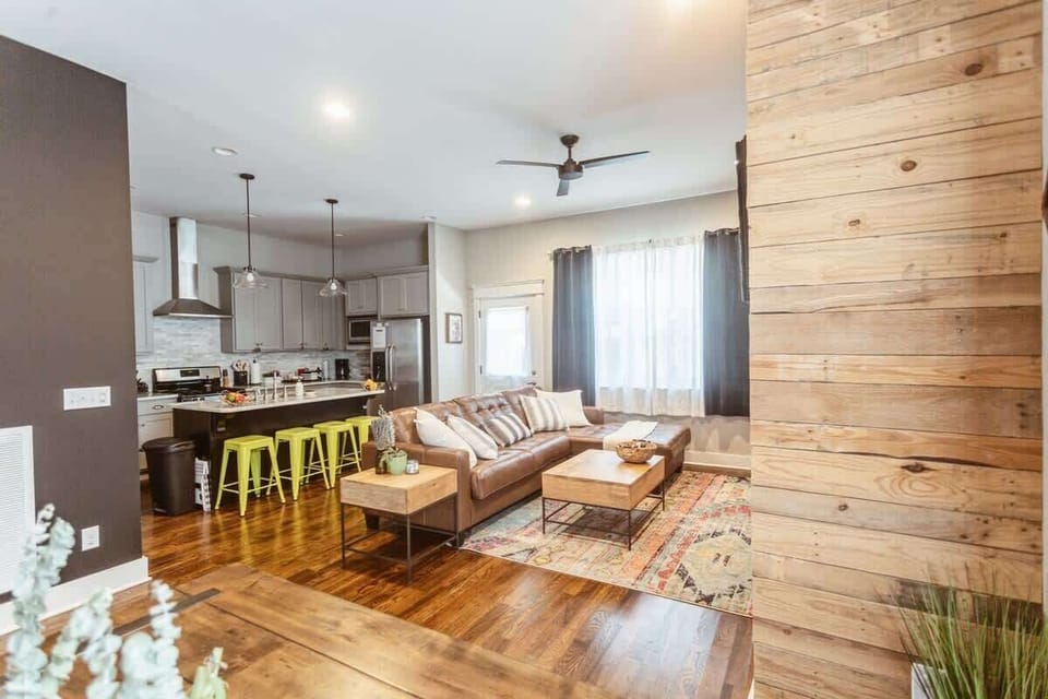 Open concept Living Room features  a leather couch, rug, etc. Includes a large TV with Amazon Prime, Hulu & Netflix. *gas to fireplace is turned off for safety *rug is different now, new pics coming soon 