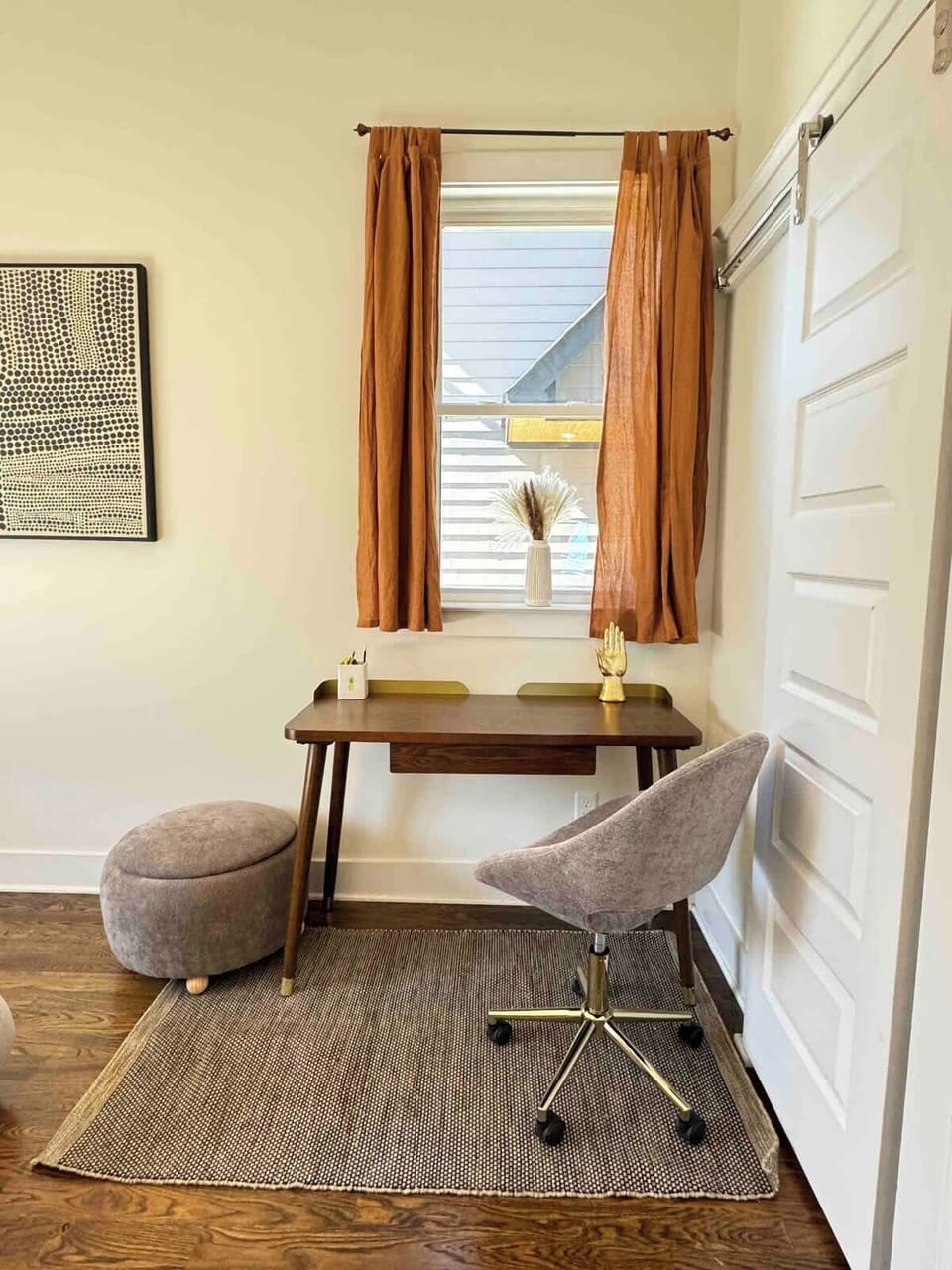 Downstairs bedroom features a beautiful wood and gold desk, & a super comfy chair and foot stool. The desk can be turned two ways depending on personal preference. *brand new furniture
