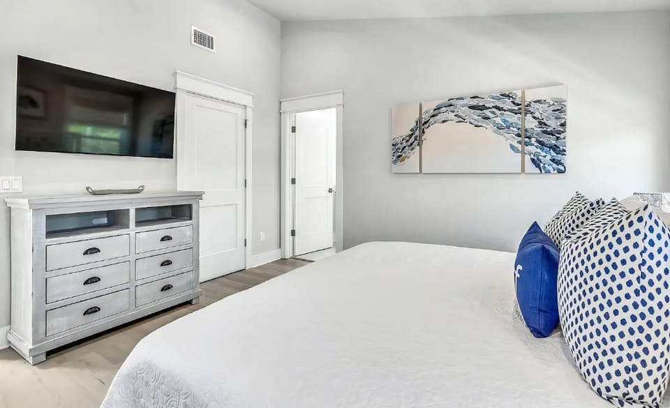 A refined bedroom setting offering comfort, quiet, and effortless relaxation.