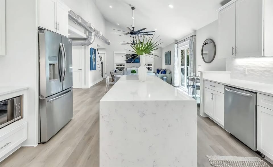 Shaped by openness, allowing the kitchen to flow naturally into the common areas.