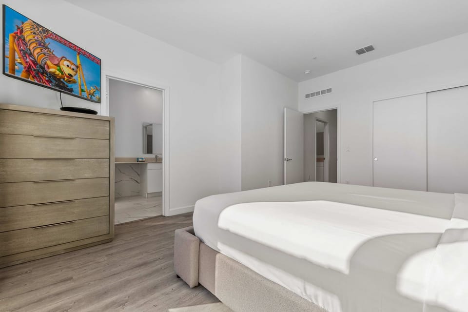 Elegant king bedroom featuring a smart TV