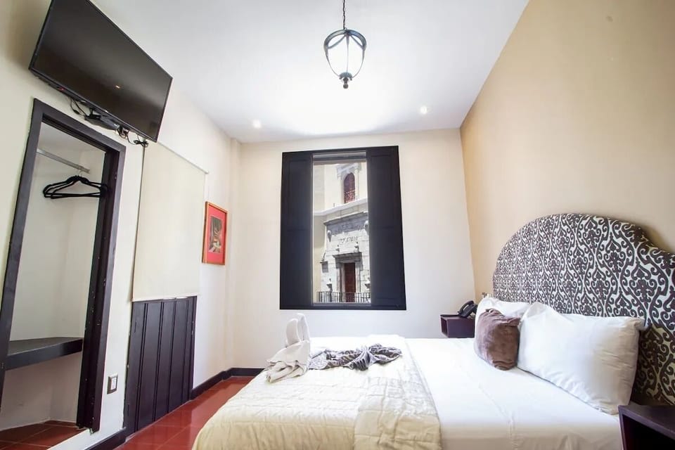 Wake up refreshed in a bright room with plush bedding
