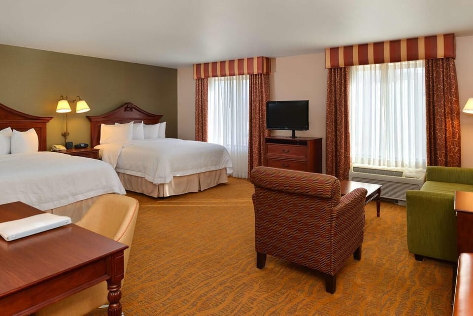 Gather in the roomy layout with seating and bright windows.