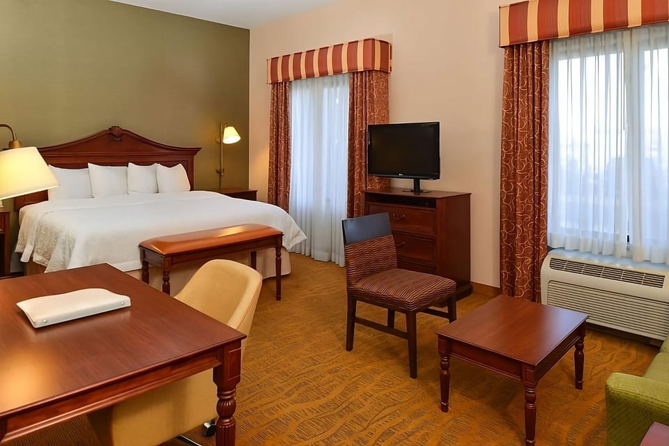 Arrive and relax in a spacious room with cozy seating.