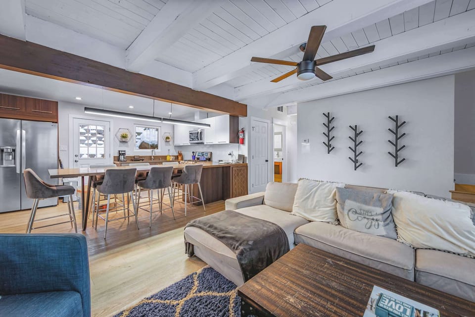 Living area with sectional sofa, gas fireplace, and Smart TV