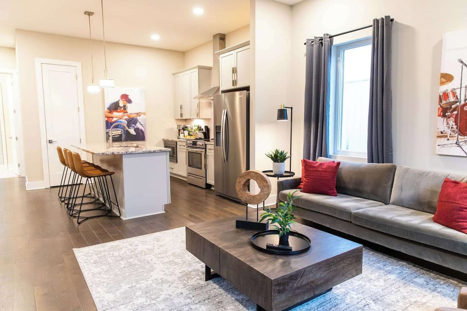 Bright, airy space with seamless flow between living and kitchen areas.