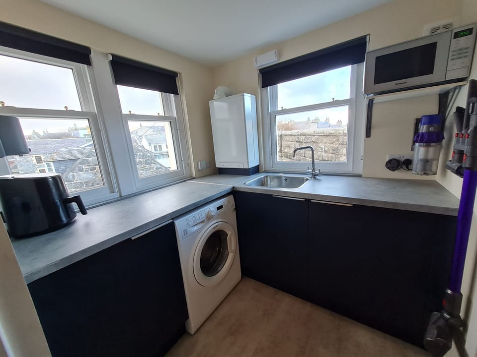 Utility room with washing machine