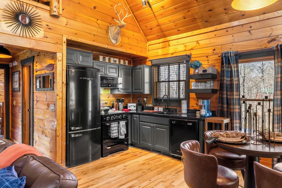Well stocked kitchen with new retro style appliances.