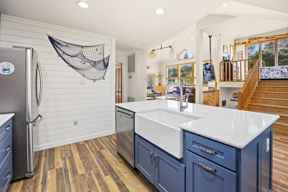 The fully equipped kitchen features modern appliances, ample counter space, and everything needed to prepare meals at home.