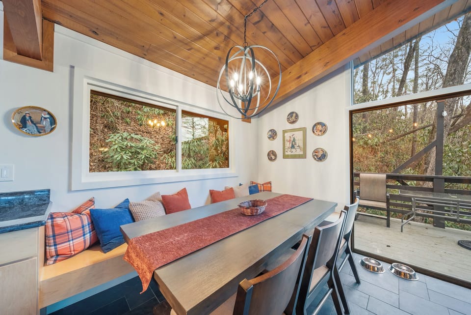 Cozy Dining Nook with Wooded Views and Seating for the Whole Group.