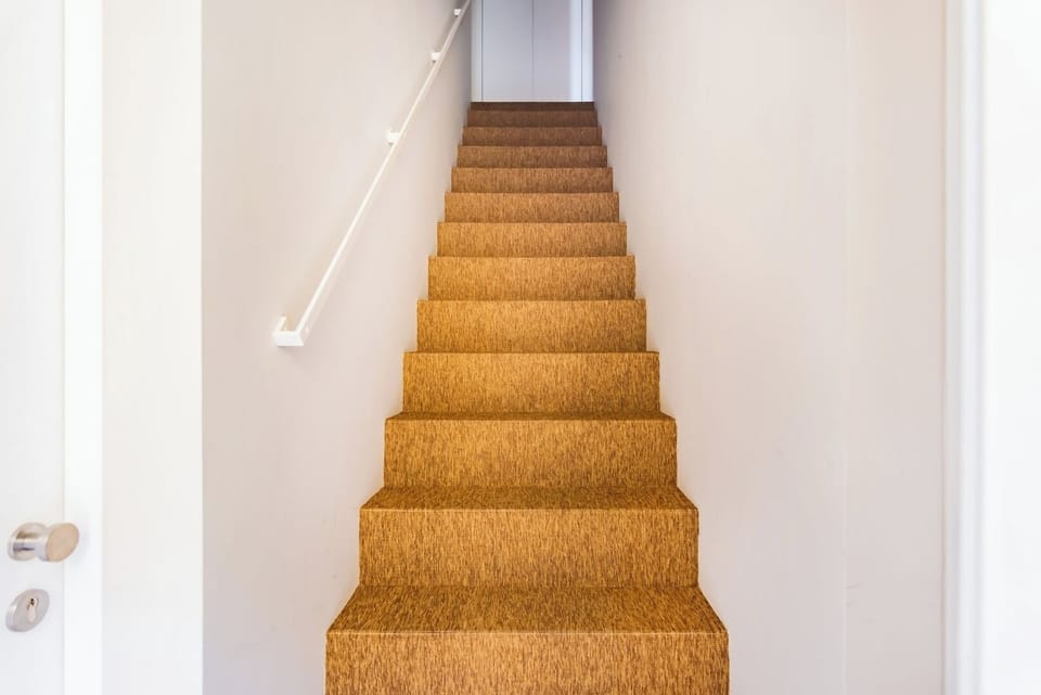 Steep and narrow stairs to access the apartment.